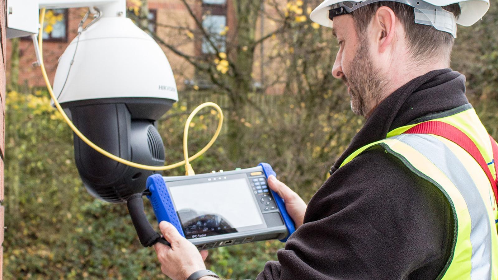 CCTV engineer testing a Hikvision PTZ camera on site in Hammersmith